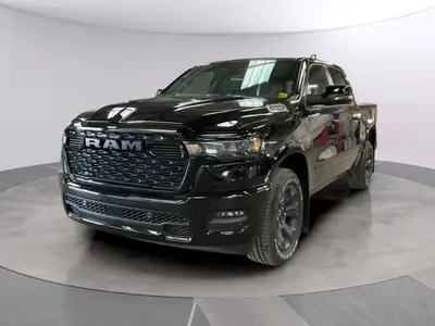 The 2026 Ram 1500 Big Horn 4x4 Crew Cab in a striking black exterior combines rugged durability with...