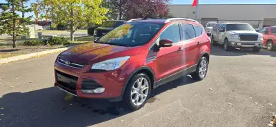 Our 2015 Ford Escape Titanium in Sunset Orange is in stock and ready for your driveway! Call to book...