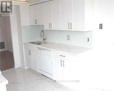 Spotless, bright and over sized 2+1 bedroom condominium in the luxurious Primrose Towers at Bathurst...
