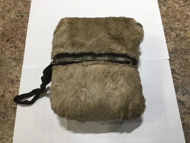 Vintage child’s furry muff, with zippered pocket. Like new. $2063871132539777120