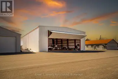Attention Pilots! Welcome to 14 Hangar Road, a 7,000 square foot detached airplane hangar in the Par...