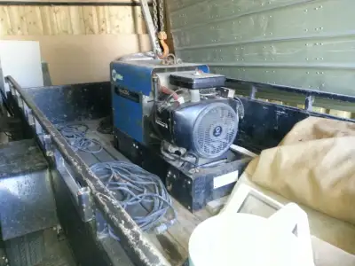 Miller Welder/generator.Stored inside.2132 hours. Comes with leads,rod oven,welding shield wall.