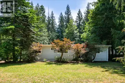 Enjoy the peaceful Cedar lifestyle in this well-maintained 3-bedroom, 2-bathroom rancher set on a be...