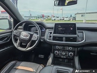 Experience the premium capability and rugged refinement of the 2023 GMC Yukon XL AT4. This used full... (image 9)