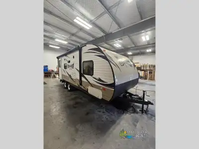 The Wildwood X-Lite 231RBXL travel trailer by Forest River offers a u-dinette slide and a rear bath...