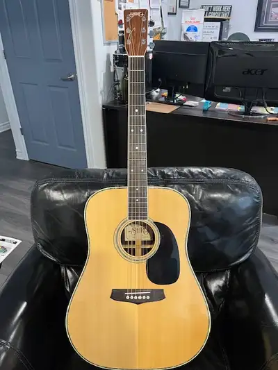 I have a 70's Shiro acoustic guitar from the renown guitar maker Shiro Aria. His higher end models h...