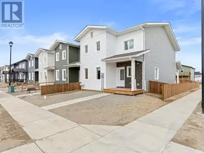 End Unit w Southerly-facing backyard! Gorgeous townhome built by Whitewater Homes which holds a 'Sup...