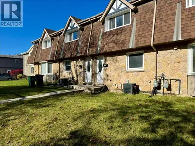 Beautifully updated freehold townhouse nestled in a peaceful, family-friendly Kitchener neighborhood...
