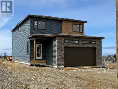 This modern style 2 story with a large attached garage is under construction on beautiful Spruce Hil...