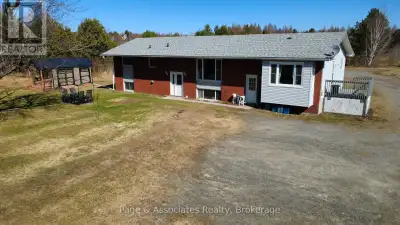 Solid investment potential meets country convenience with this well-maintained triplex set on a spac...