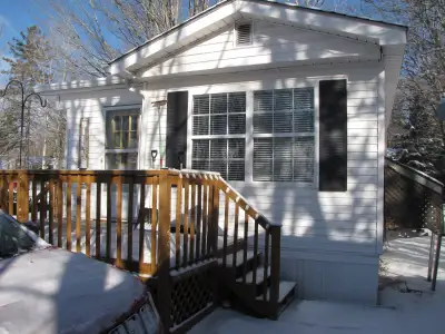 Beautiful 2 bedroom mini home sitting on corner lot with large baby barn with electric, home has lot...