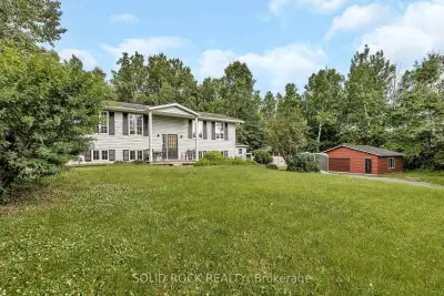 Discover this meticulously designed highranch bungalow, nestled on just over an acre of property bet...