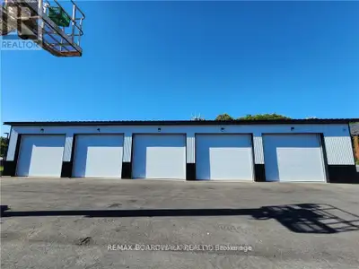Excellent opportunity to lease a well-maintained commercial garage building featuring multiple overh...