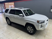 The 2015 Toyota 4Runner 4WD 4dr V6 SR5, in its striking White exterior paired with a robust 44 drive... (image 4)
