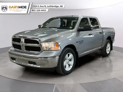 Experience the rugged charm of the 2023 Ram 1500 Classic SLT in a sophisticated Silver finish with d...