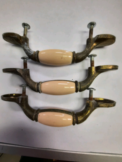 Six porcelain and brass handles, View more