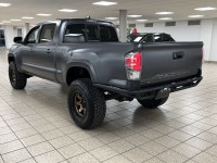 Among midsize pickups that talk tough but feel soft when the work gets real, this 2021 Toyota Tacoma... (image 3)