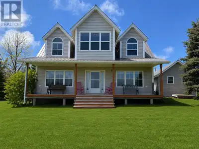Welcome to your turn key, waterfront retreat in the highly sought-after Hebrides community of New Lo...