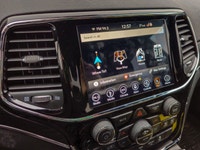 Introducing the stunning 2019 Jeep Grand Cherokee Limited 4x4, a vibrant orange SUV that promises an... (image 9)