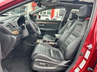 Command the road in the breathtaking Radiant Red Metallic 2021 Honda CR-V Touring, a sophisticated s... (image 8)
