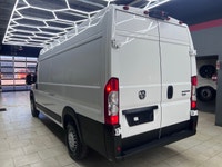 The 2025 Ram ProMaster Cargo Van in a clean white finish, equipped with front-wheel drive, is design... (image 7)