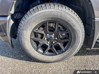 This 2021 Ram 1500 Sport Crew Cab, striking in Granite Crystal Metallic, stands ready for action, bo... (image 8)