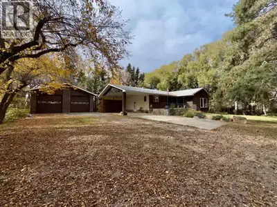 Beautiful 7 acre property just minutes from Lethbridge with full pavement access and connected to ci...
