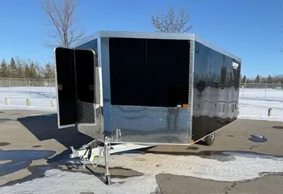 8.5x12 trailer. V-nose design, with side door and ramp door. Slide track with adjustable tie down lo...
