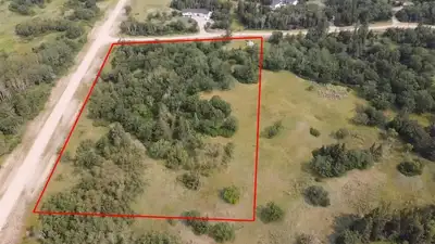 R36//Carberry/Gorgeous five-acre corner lot in the serene Oak Sands Development. This heavily treed...