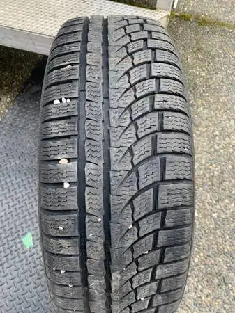 a nice Pair of Nokian all weather winter tires in great shape (2 TIRES ONLY) size 215 65 17 215/65/1...