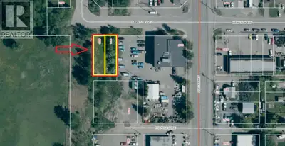 Price includes 2 city view lots (66x106) beside school yard. Great potential view lot! City services...