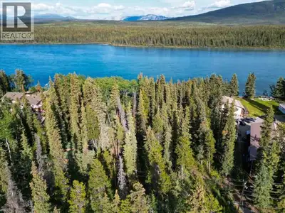 Escape to your premier angler's retreat at 1402 Tagish Road! This 1.5-acre riverfront gem on 6 Mile...