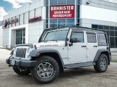 The 2018 Jeep Wrangler JK Unlimited Rubicon in stunning white with an all-wheel-drive system invites...
