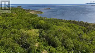 23 ACRES of PRIME WATERFRONT property with OVER 1100ft of beach-front on Aspy Bay with views of Tene...
