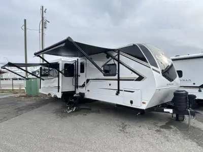 Keystone Cougar Half-Ton travel trailer 29RLPWE highlights: King Bed Full Bath Kitchen Island Two 10...
