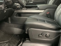 The 2026 Ram 1500 Rebel 4x4 Crew Cab in a striking black hue offers a commanding presence on any ter... (image 9)