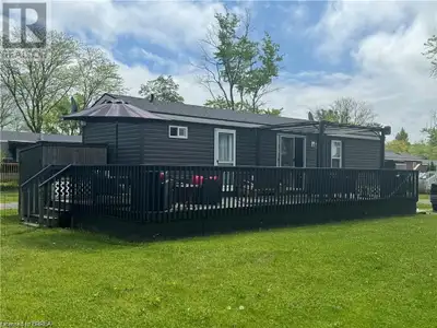 Welcome to the perfect seasonal home in Niagara-on-the-Lake. Surrounded by vineyards, it offers a tr...