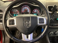 A red 2011 Dodge Avenger SXT easing through the day has a way of making routine driving feel more de... (image 9)