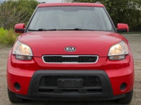 The 2011 Kia Soul 2u in a vibrant red with front-wheel drive is a vehicle built for handling the dem... (image 5)