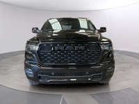 The 2026 Ram 1500 Big Horn, presented in a commanding Black finish and equipped with a robust 4x4 dr... (image 7)