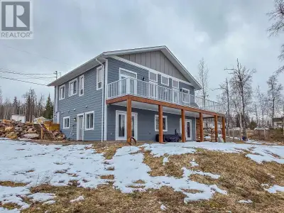 Rare find! Custom built home with a stunning mountain view and legal suite! Located in a desirable n...