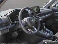 Introducing the 2026 Honda CR-V LX, a stunning black SUV that combines the sophistication of a moder... (image 7)