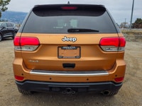 Introducing the stunning 2019 Jeep Grand Cherokee Limited 4x4, a vibrant orange SUV that promises an... (image 2)