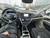 Experience the 2024 Chrysler Grand Caravan SXT in a pristine white finish, complete with efficient f... (image 6)