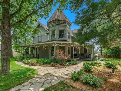 The Tranquility of Waterfront Living Awaits You in This Elegant Victorian-Style Home Nestled along t...