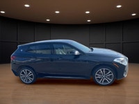 The 2022 BMW X2 xDrive28i Sports Activity Coupe in a sophisticated black finish and equipped with BM... (image 4)