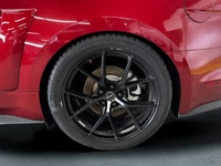 The 2016 Ford Mustang GT in vibrant red with a rear-wheel-drive setup promises dynamic handling and... (image 7)