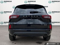 The 2024 Ford Escape ST-Line in sleek black boasts AWD capabilities, making it a versatile and relia... (image 4)