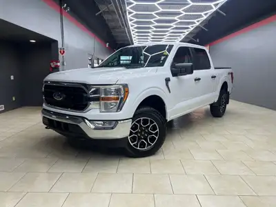 Experience the power and versatility of the 2022 Ford F-150 XLT 4WD SuperCrew, a white powerhouse bu...