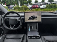 This Tesla Model 3 delivers a Electric engine powering this Automatic transmission. Window Grid Ante... (image 9)